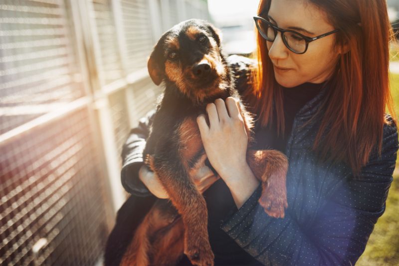 woman holding dog